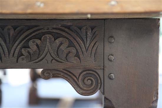 A large carved oak refectory table, 11ft 8in. x 2ft 11.5in. x 2ft 6.5in.